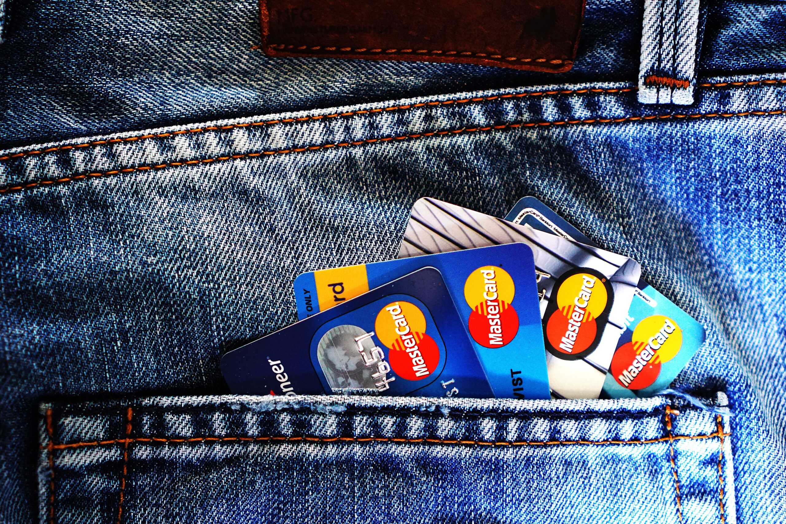 A close up of credit cards in someones pocket